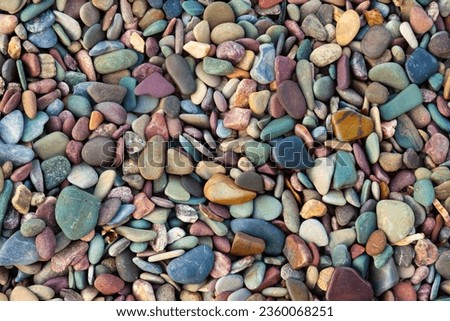 Colorful stones on the shore of Waterton Lake in Waterton Lakes National Park, Alberta, Canada
