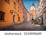 Colorful summer cityscape of Lublin town, Poland, Europe. Amazing morning view of old town square with Cracow Gate on background. Traveling concept background.