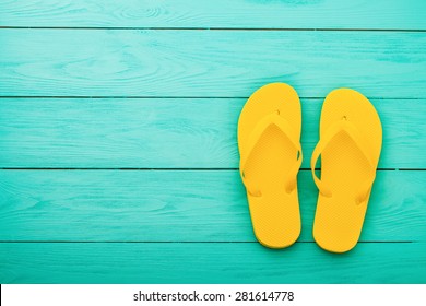 Colorful Summer. Flip Flops On Blue Wooden Background.