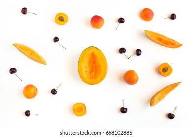 Colorful summer fruits pattern with melon slices, apricots and cherries isolated on white background - Shutterstock ID 658102885