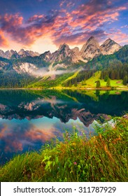 Colorful summer sunrise on the Vorderer Gosausee lake in the Austrian Alps. Austria, Europe.