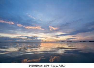 Colorful summer sunset with the Blue waters of the Palic Lake, in Subotica, Serbia, with the sunny sky reflecting on the water. Also known as Palicko Jezero, it is one of the attractions of Vojvodina - Shutterstock ID 1635777097