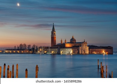 Colorful sunrise at the Giudecca Canal to the island of San Georgio Maggiore, with its campanile and church designed by Palladio, Venice, Italy
