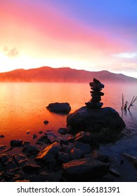 Colorful Sunrise At Harrington Lake, Northeast Piscataquis, Maine With Cairn.