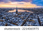 Colorful sunrise over the snowy Gamla stan, Stockholm Sweden