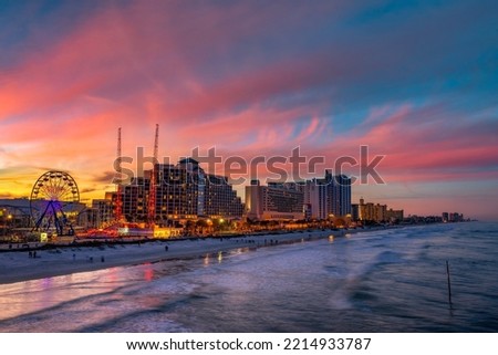 Colorful sunset above Daytona Beach, Florida, photographed from the fishing pier.