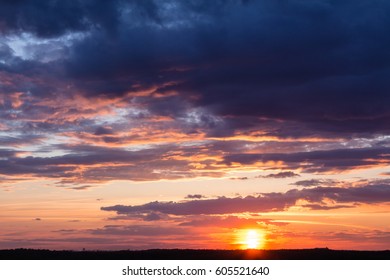 Colorful sunset with clouds in the evening - Shutterstock ID 605521640