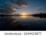 Colorful sunset cloudscape over Pine Glades Lake in Everglades National Park, Florida.