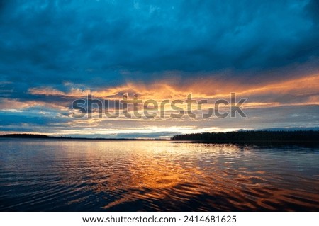 Colorful sunset щк dawn, over the lake, river, sea, blue and red color, calm beauty, nature, evening or morning