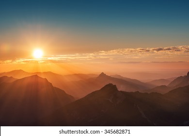 colorful sunset on top of austrian mountain alps - Powered by Shutterstock