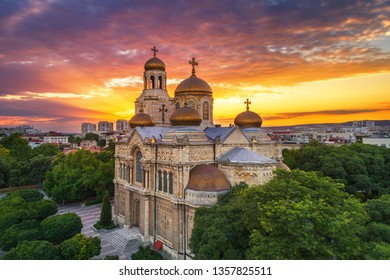 Colorful sunset over The Cathedral of the Assumption in Varna, aerial view