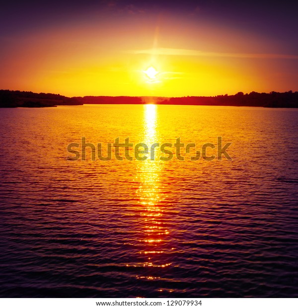 Colorful Sunset Over Water Surface Stock Photo Edit Now 129079934