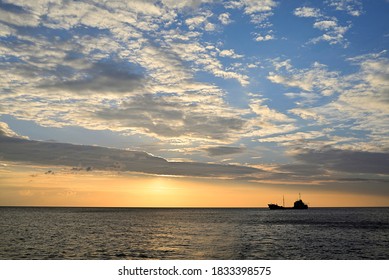 Colorful Sunset Silhouette Of A Merchant Ship In The Mediterranean Sea