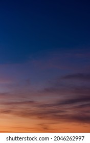 Colorful Sunset Sky Vertical In The Evening On Twilight With Orange Sunlight On Dark Blue Hour Background 