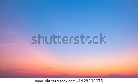 Colorful sunset and sunrise with clouds. Blue and orange color of nature. Many white clouds in the blue sky. The weather is clear today. sunset in the clouds. The sky is twilight