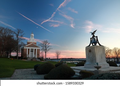 Colorful Sunset At United States Merchant Marine Academy Chapel With Memorial Bell In Foreground