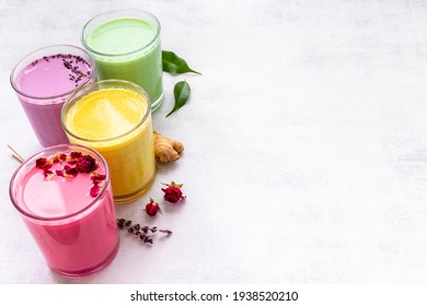 Colorful super latte coffee or tea with turmeric, beetroot and matcha