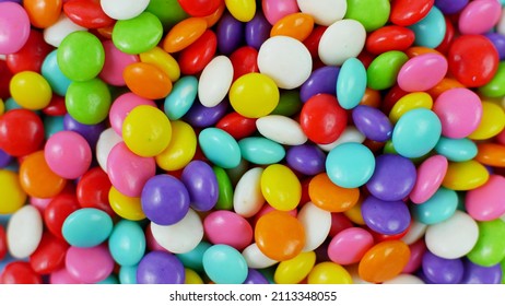 Colorful Sweet Candy Balls On Blue Pastel Background. Trendy Color For Wallpaper Or Background.