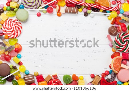 Colorful sweets. Lollipops and candies. Top view with space for your greetings