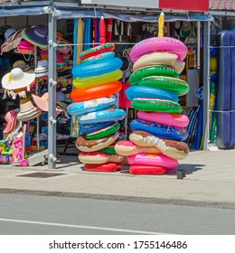 Colorful Swim Rings For Sale At A Beach Store. Beach Articles For Happy Holidays 