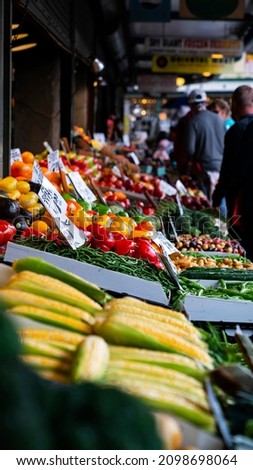 A colorful table of fruit and vegetables for sale at a stall in a farmers market in the middle of Seattle, Washington