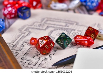 Colorful Tabletop Role Playing RPG Game Dices On Blurry Hand Drawn Dungeon Map