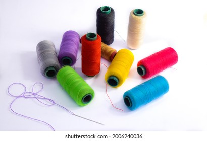 Colorful textile threads on a white background