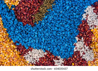 Colorful Texture Of Chemically Treated Corn Maize Crop Seed Ready For Seeding