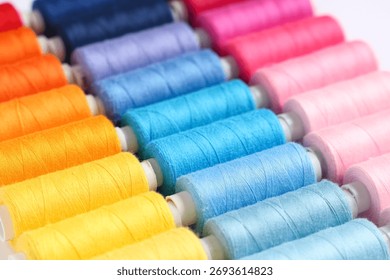 Colorful thread spools as background