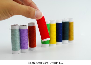 Colorful Thread, a thin string of cotton used for sewing or making fabric on white background. Abstract background.