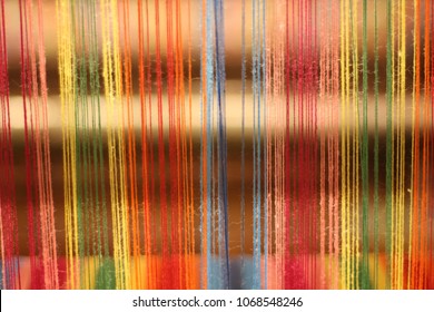 Colorful threads on a vintage loom