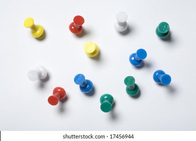 Colorful Thumb Tacks On A White Background