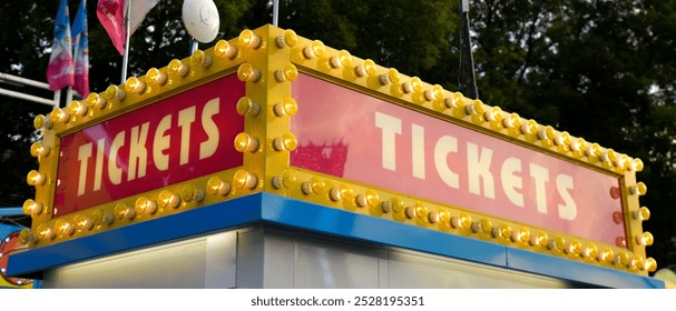 Colorful Ticket Booth neon sign at the amusement park - Powered by Shutterstock