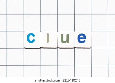 Colorful Tile Letter In Word Clue On White Grid Background