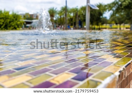 Colorful tiles in infinity fountain in modern public park
