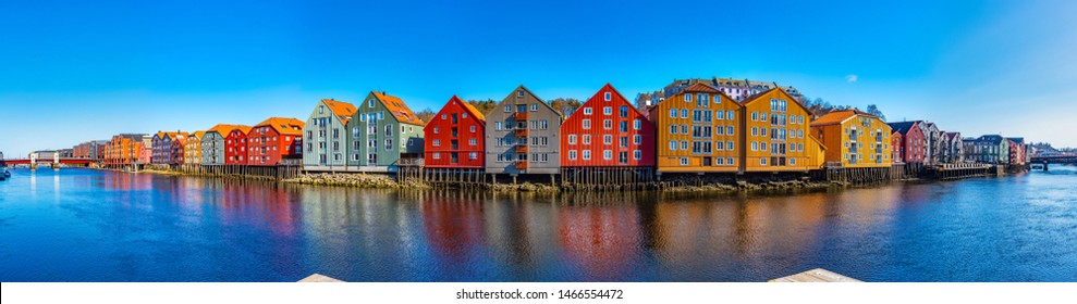 Colorful Timber Houses Surrounding River Nidelva In The Brygge District Of Trondheim, Norway
