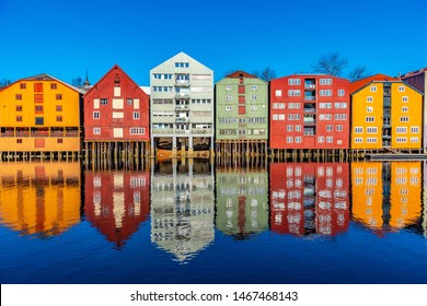 Colorful Timber Houses Surrounding River Nidelva In The Brygge District Of Trondheim, Norway