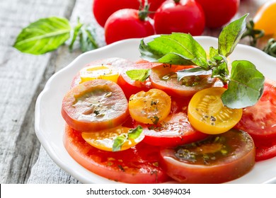 Colorful Tomato Salad Basil White Plate On Rustic Wood Background