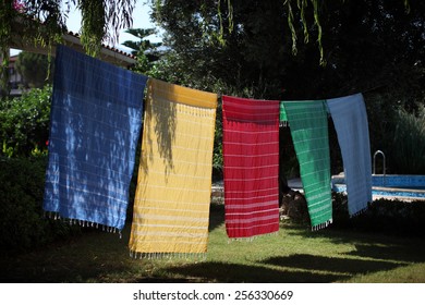 Colorful Towels Hanging On The Clothes Line