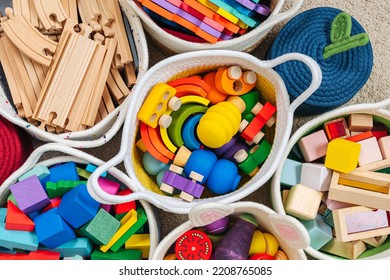Colorful Toy Storage Baskets in the children's room. Cloth stylish Baskets with wooden toys. Organizing and Storage Ideas in nursery. Clean up toys and reduce the clutter. Top view - Shutterstock ID 2208765085
