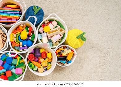 Colorful Toy Storage Baskets in the children's room. Cloth stylish Baskets with wooden toys. Organizing and Storage Ideas in nursery. Clean up toys and reduce the clutter. Top view - Shutterstock ID 2208765425