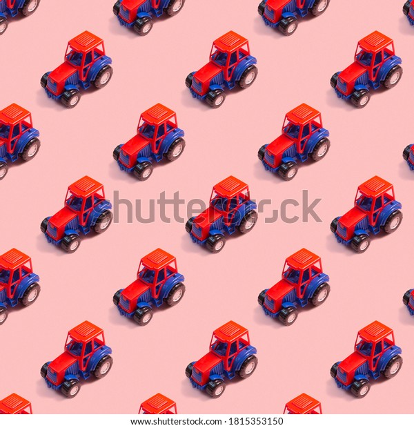 Colorful toy tractor in neon lights against pink\
background. Seamless\
pattern.