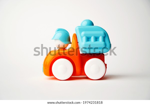 Colorful toy truck on a white background with copy\
space. Construction truck\
toy