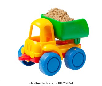 Colorful toy truck with sand isolated over white background
