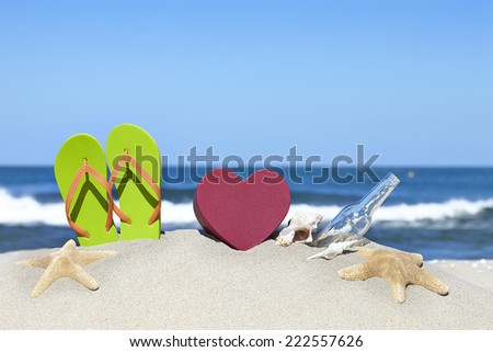 Colorful toys for sandboxes against the sea and the beach.