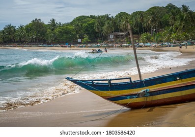 Colorful traditional fishing boat on the beach, Arugam Bay, Sri Lanka