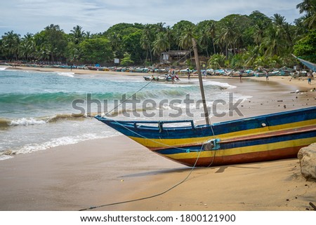 Colorful traditional fishing boat on the beach, Arugam Bay, Sri Lanka