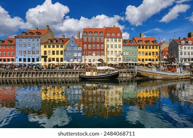 Colorful traditional houses in the Old port of Nyhavn in Copenhagen, Denmark. Nyhavn port is a popular travel destination and main landmark of Copenhagen city. - Powered by Shutterstock