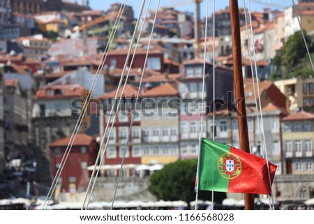 Similar – Image, Stock Photo Portuguese flag on boat in front of old town of Porto / Portugal