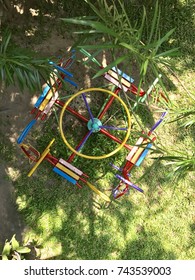 Colorful Traditional Metal Carousel/merry Go Round/roundabout On Playground On Sunny Day With Copy Space Of Shadow Of Trees On Lawn As Background - Childhood Holiday Joyful Memory Concept - Top View